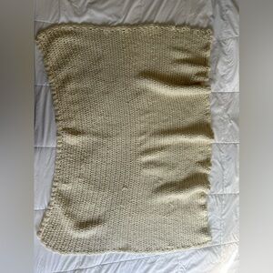 Cream colored homemade crocheted blanket